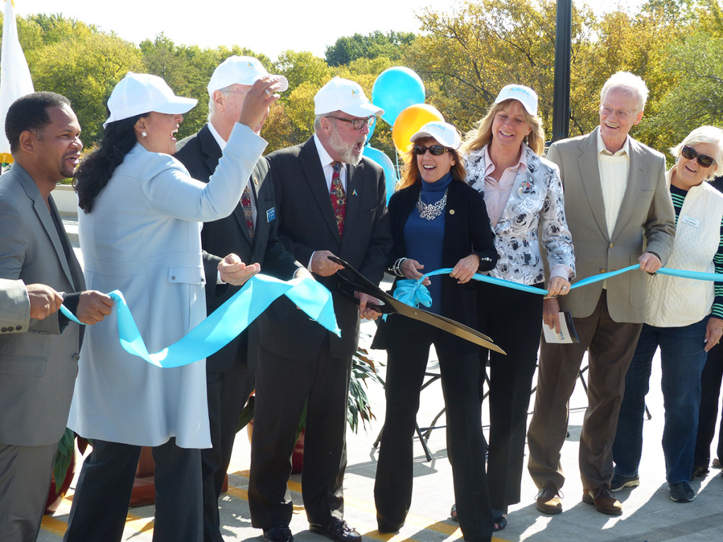 Aurora Mayor Tom Weisner, center, along with officials, celebrate the Oct. 16 opening of the Indian Trail bridge. Originally constructed in 1963, the bridge was in much needed repair. More than 21,000 vehicles travel across the bridge each day. Jennifer Rice/staff photographer
